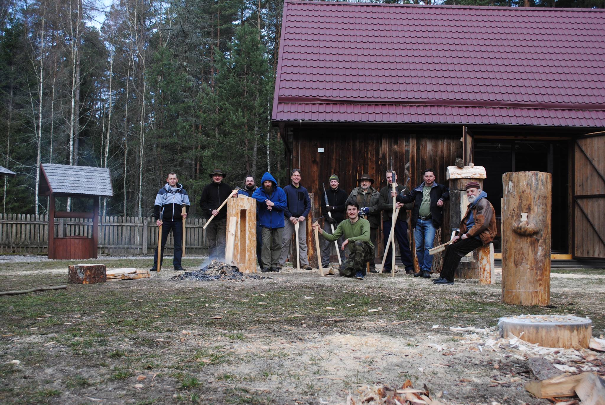 Beekeepers pictured next to traditional wild bee nests.